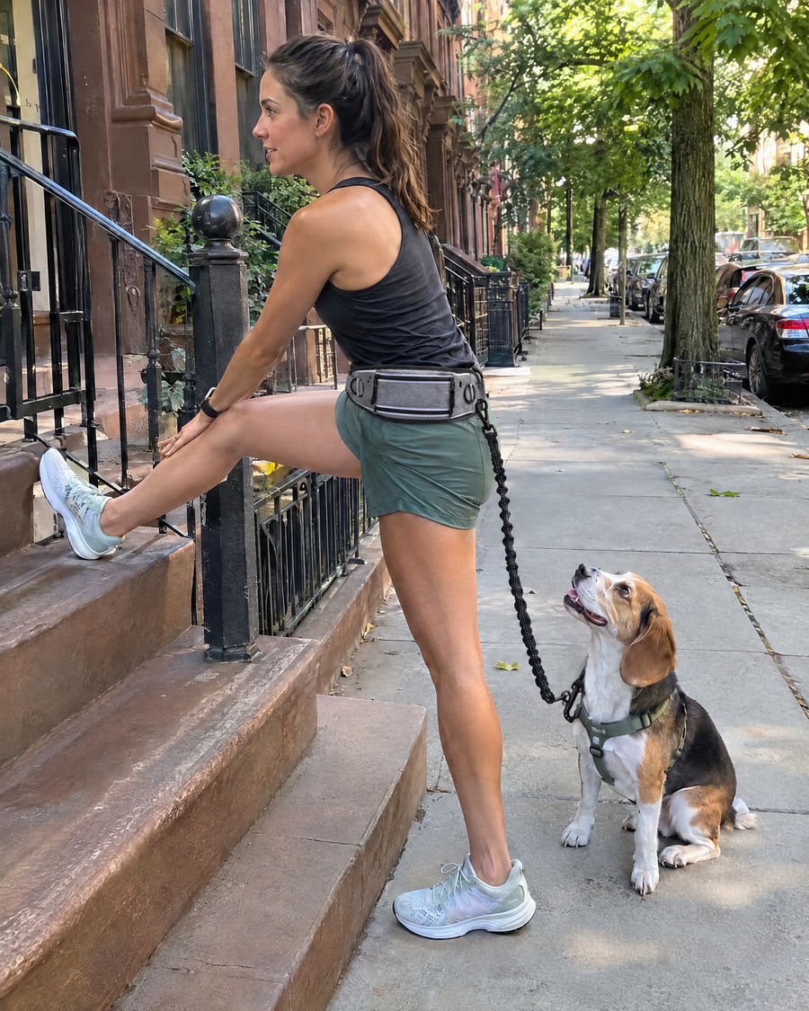 Woman stretching on a Brooklyn stoop with her beagle after a run